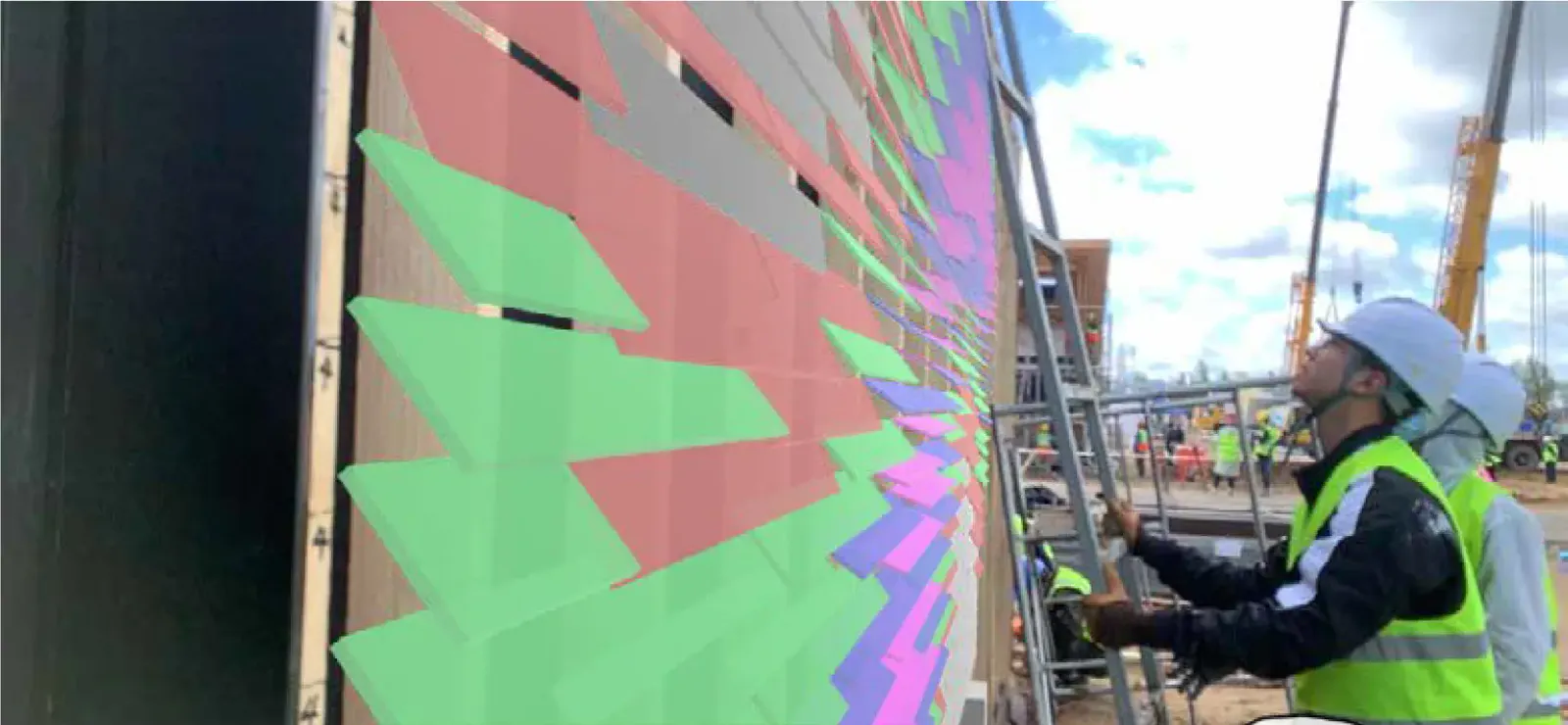 A facade seen through AR, tiles overlaid in green, red and purple by angle, as two workers install them