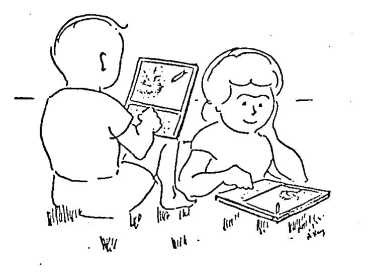 Two children sitting on the grass, each with a Dynabook