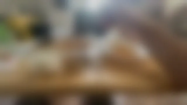 The camera's frame, blurred: a kitchen counter